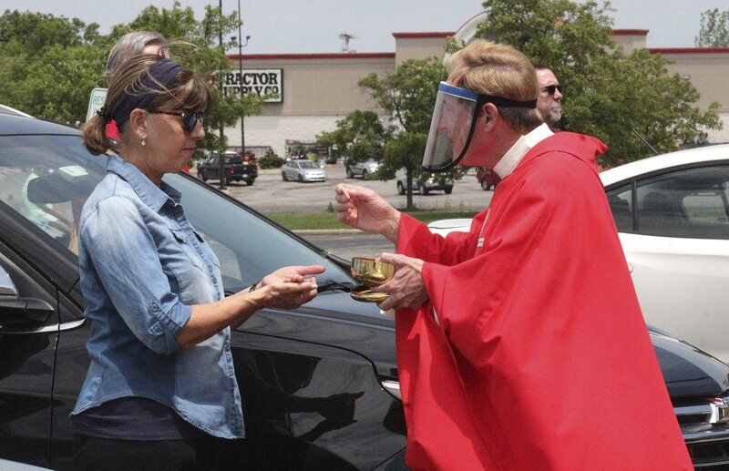 Parish celebrates Mass in former Sears parking lot